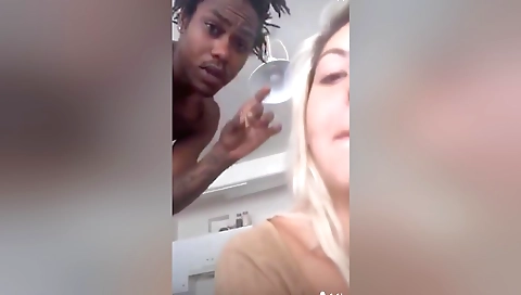 Hot and sexy blonde girl in tight shorts is on a video